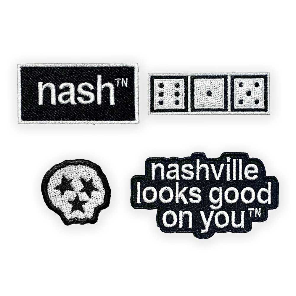 Four Nashville themed iron on clothing patches. Patch one: a black rectangle outlined in white with the white nashᵀᴺ  logo. Patch 2: a white rectangle with three game dice showing the numbers six, one, and five. Patch 3: a white skull shaped patch with three black stars. Patch 4: a black patch nashville looks good on you in white letters.