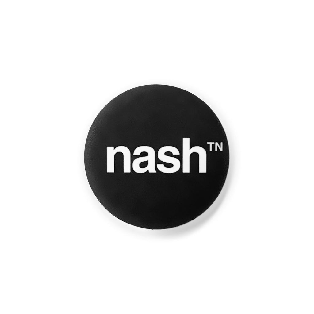 Black, round lapel pin button on a white background. The button has the word nashᵀᴺ  in white. nash is short for Nashville. The design mark uses a super script or small TN at the top right of the letter h. TN is the abbreviation for Tennessee. 
