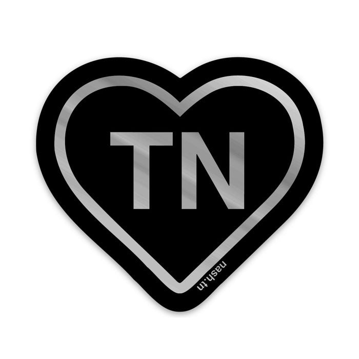 Heart shaped sticker on white background. Black outline and black heart with silver holograph outline and letters TN in center of heart. TN is the abbreviation for Tennessee. 