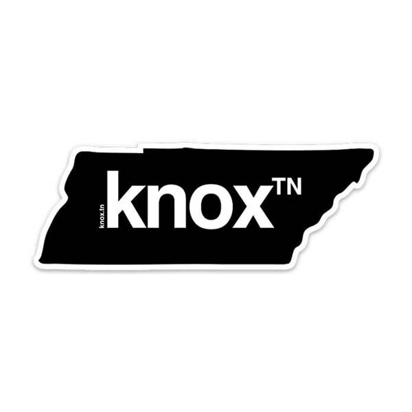 Black sticker on a white background. The sticker is shaped like the state of Tennessee with the knoxᵀᴺ logo printed in the center of the shape in white. Knox is short for Knoxville, a well-known city in Tennessee because of the University of Tennessee.
