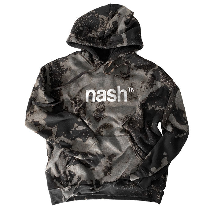 Hooded sweatshirt with nashᵀᴺ  logo printed in white. The sweatshirt has been dyed and bleached to have to have a marbled appearance with grays, browns and blues