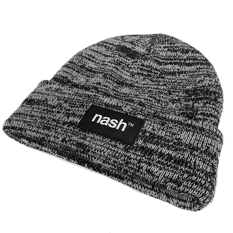 Angled view showing texture and thickness. Cuffed, gray and black marled knit beanie with black logo patch on cuff shown on white background.