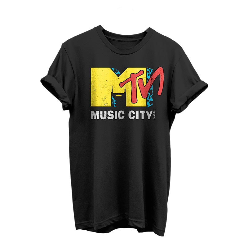 Black short sleeve T-shirt with colorful design on a white background. Nashville is known as Music City and this shirt is a parody of a vintage design. The Batman Building is shown in the negative space of the yellow letter M. TN is written in red at an angle across the M. Music City is written in white block text across the bottom of the design.
