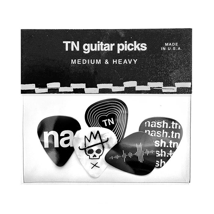 Packet of five guitar picks on white background