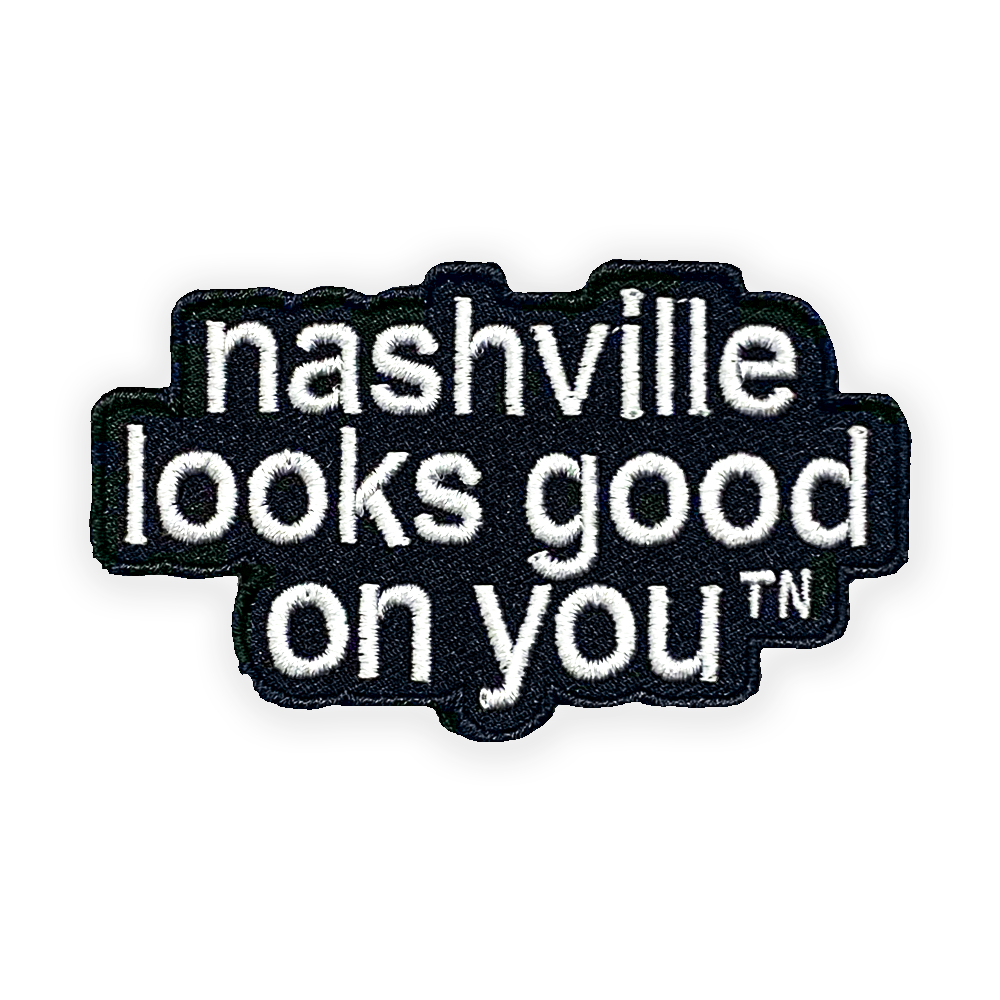  A closeup look at a black patch with white letters. Nashville looks good on youᵀᴺ in white letters.