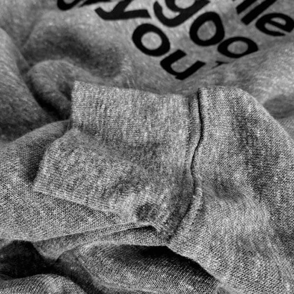Close up of wrist cuff detail on the gray nashville looks good on you nashᵀᴺ  crewneck sweatshirt.