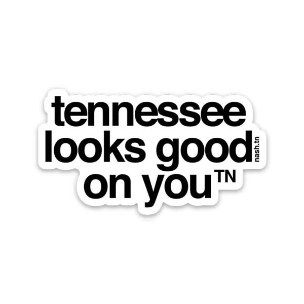 White sticker with black text on a white background. The sticker is cut out around the letters and has an bumpy shape. the text reads tennessee looks good on youᵀᴺ  